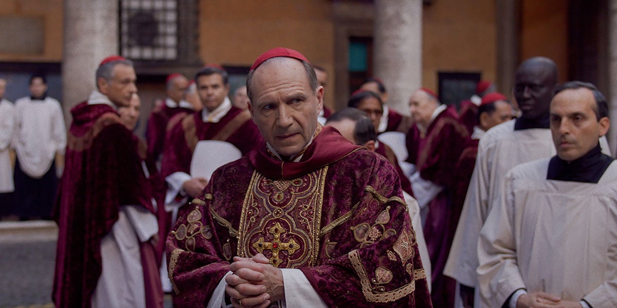 Ralph Fiennes dons papal attire in a still from 'Conclave'